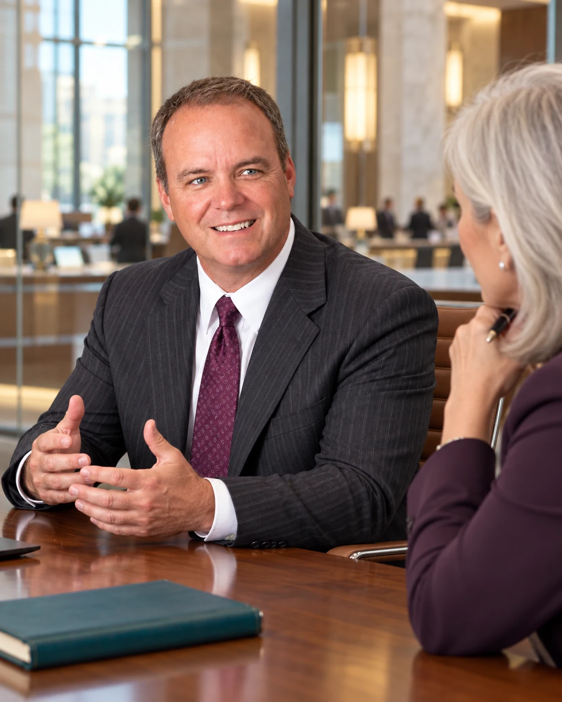 Ken Rowe meeting with a banking executive.